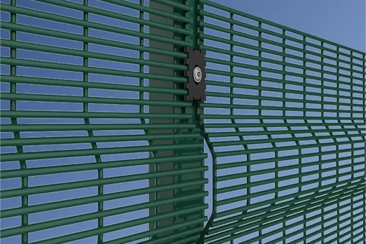 Green close mesh fence panel with V shaped bend and post fixing