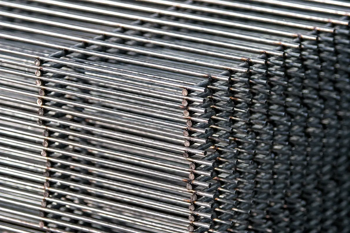 Stacked welded mesh panels showing straight parallel wires and intersections