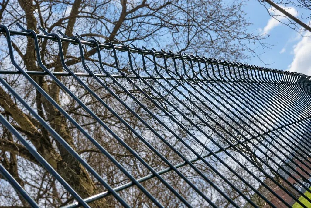 Profiled welded mesh fence with bends visible along the upper edge