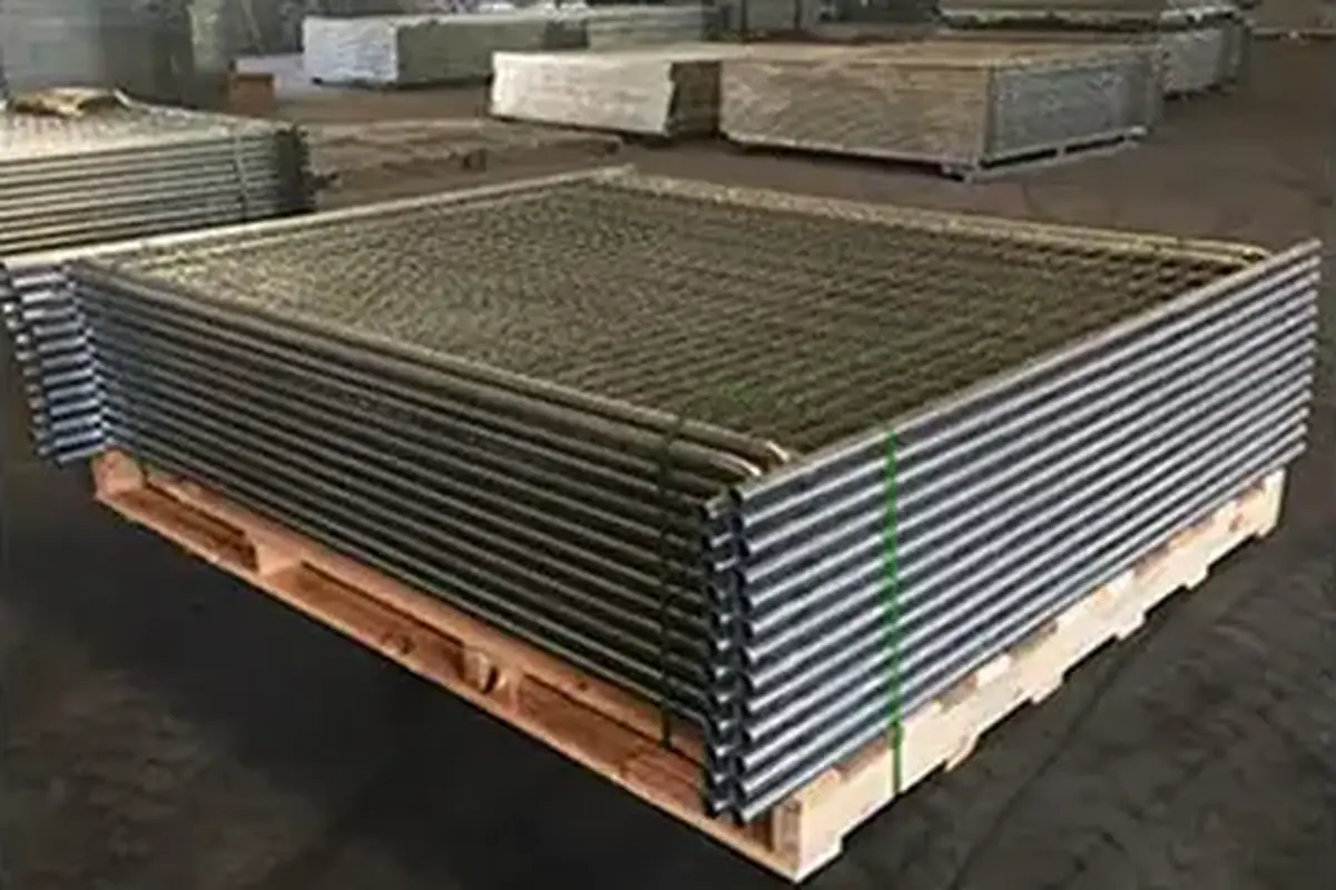 Stacked welded mesh fence panels strapped to a wooden pallet