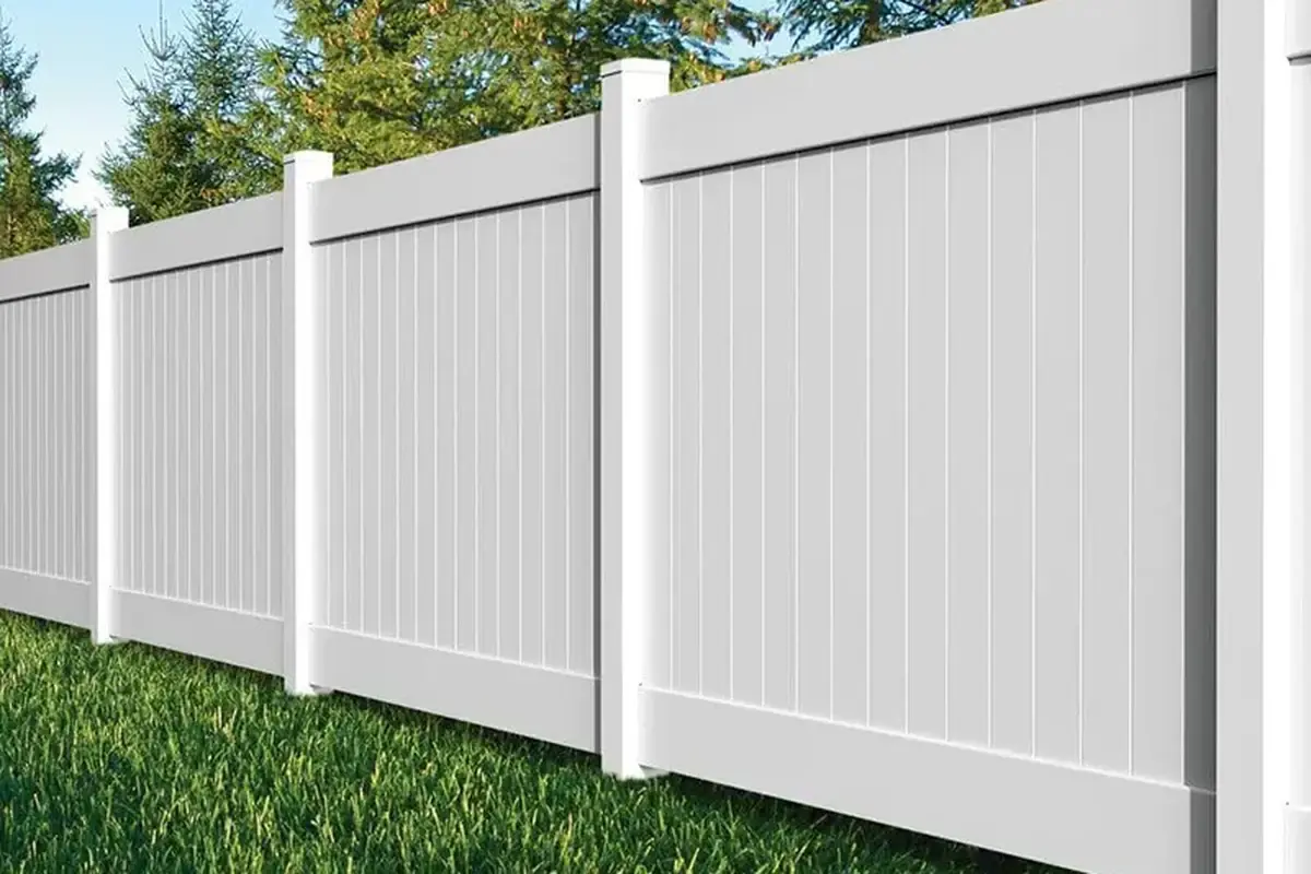 White solid privacy fence panels along a garden boundary