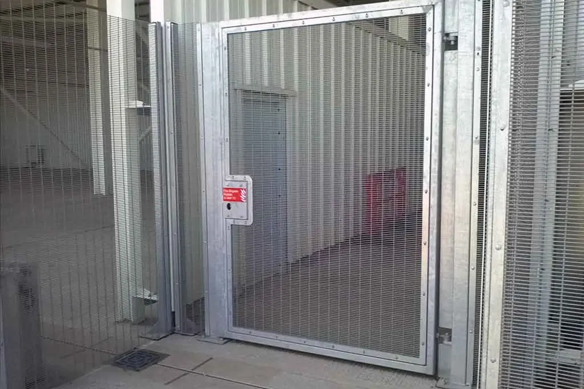 Open metal pedestrian gate showing its lower edge above the floor
