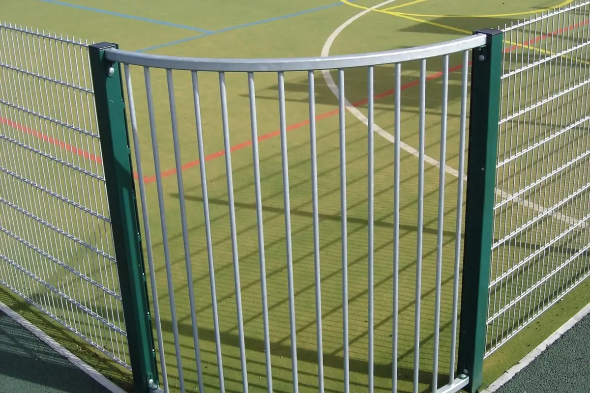 Sports fence panels joining around a curved corner post
