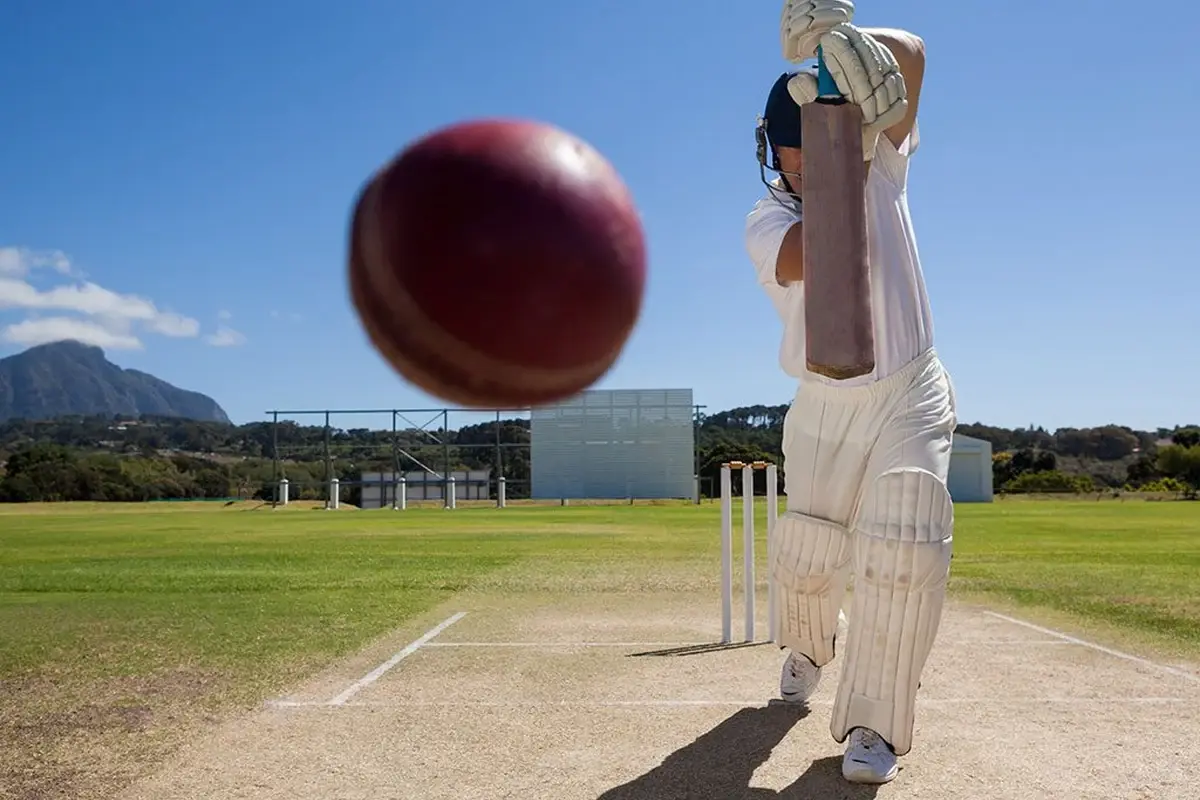 Cricket batter playing on an open ground