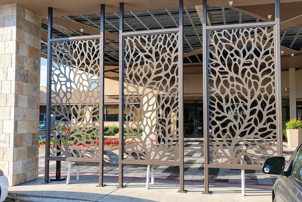 Patterned metal screens installed beside a building entrance