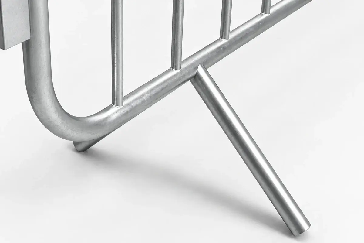 Close view of a welded fixed foot on a metal crowd barrier
