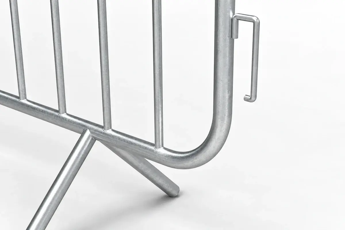 Close view of a metal crowd barrier hook and fixed foot