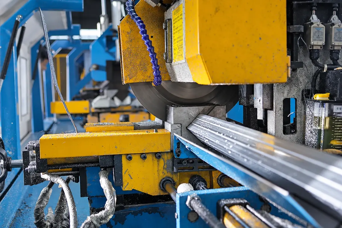 Steel fence section being cut with a workshop machine