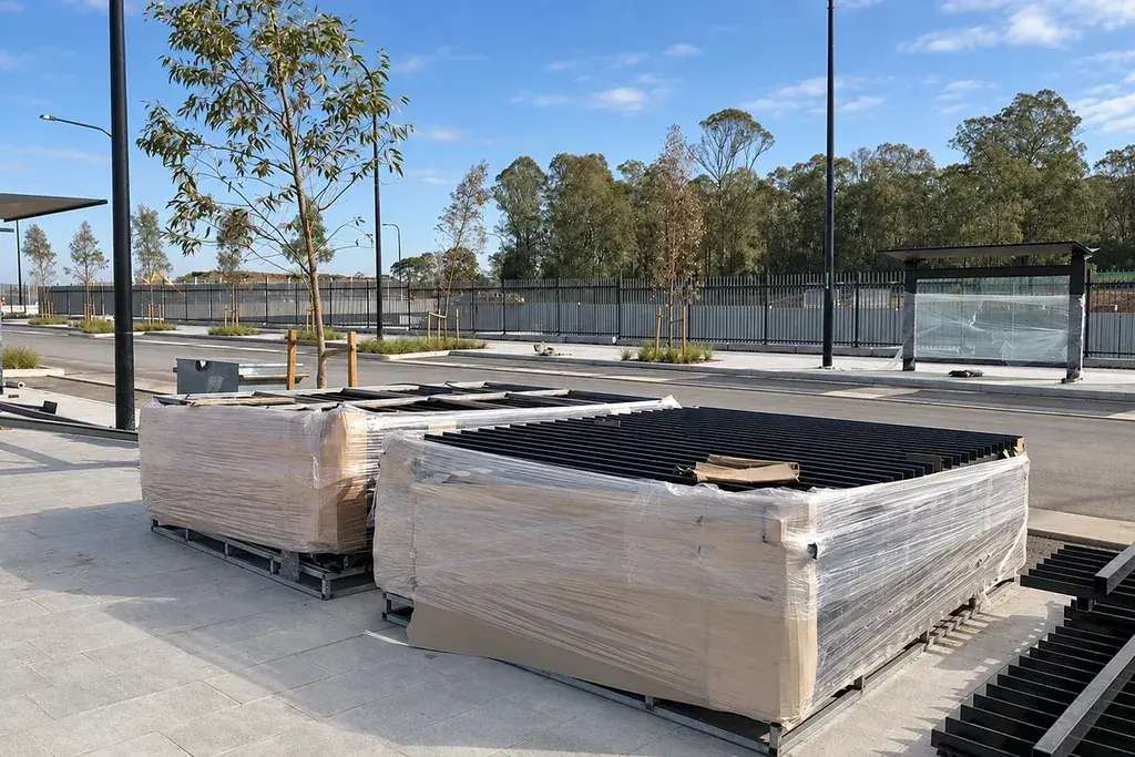 Wrapped fence panel stacks staged outdoors