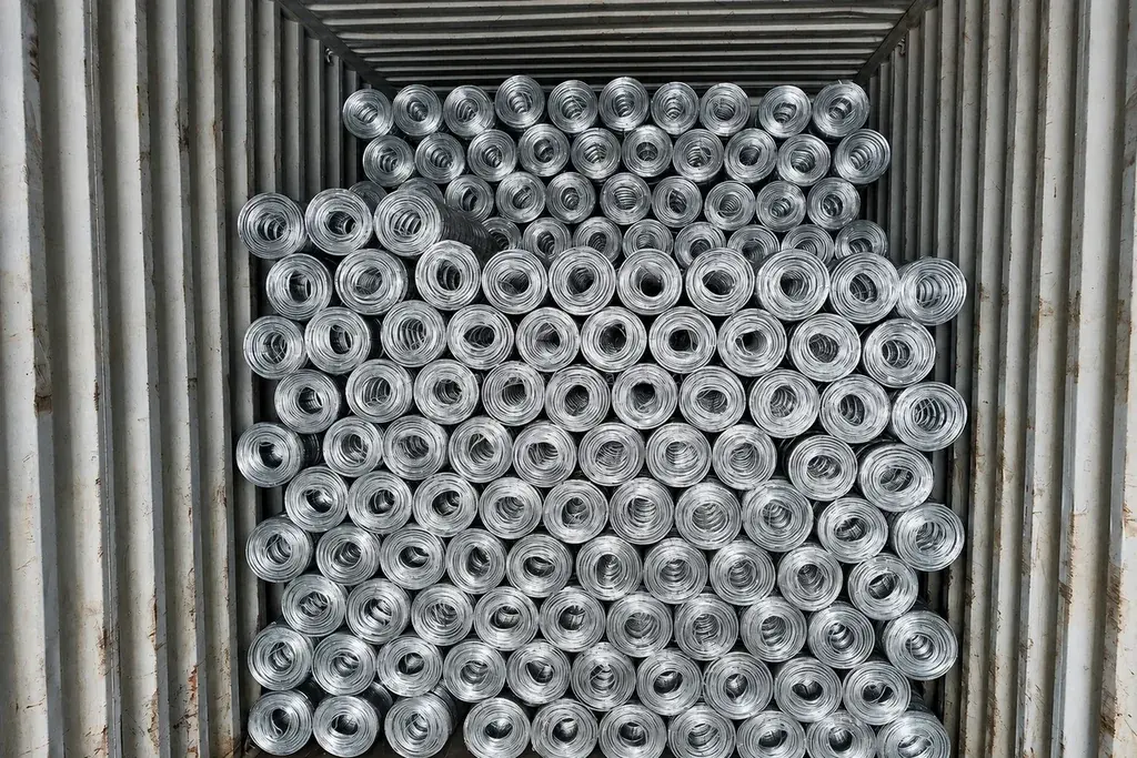 Packed wire fence rolls stacked in a shipping container