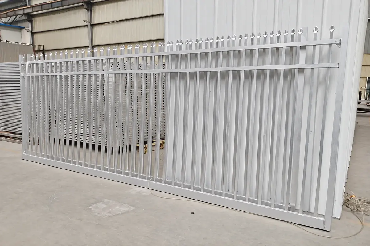 White steel gate assembly standing inside a production facility