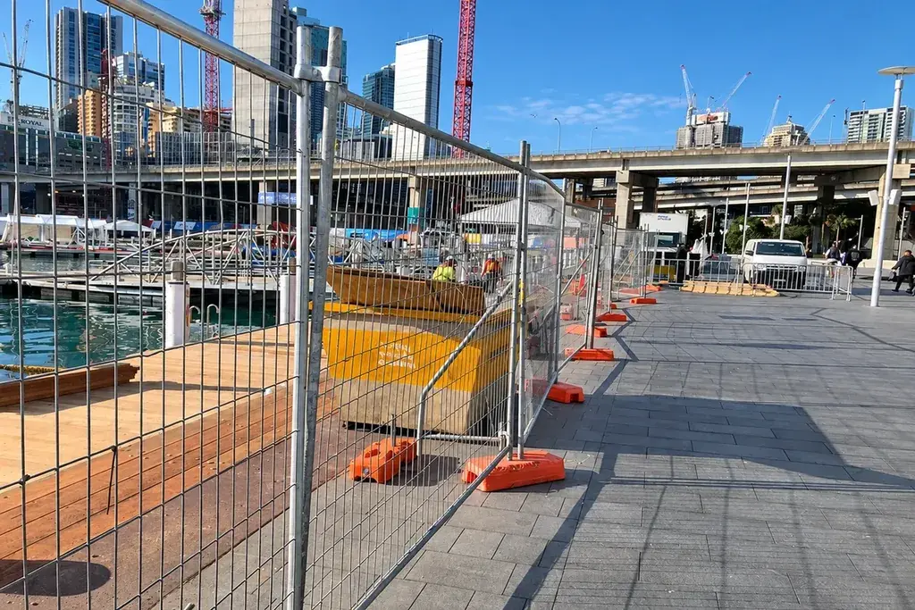 Temporary mesh fence panels around an urban construction area