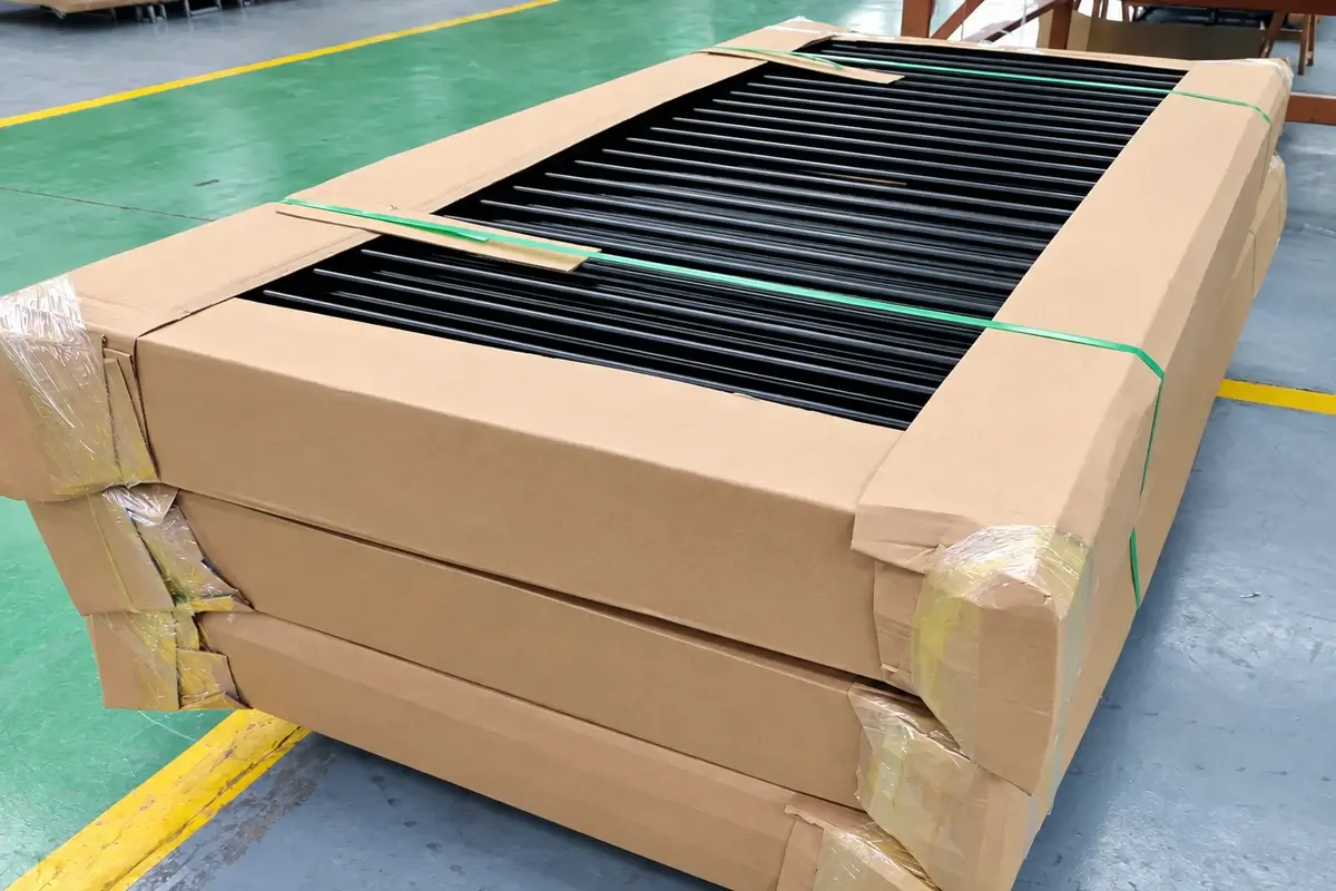 Black fence panels protected in a cardboard shipping package