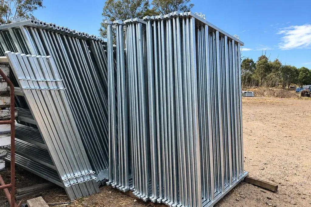 Stacks of galvanised steel gate frames stored for installation or replacement