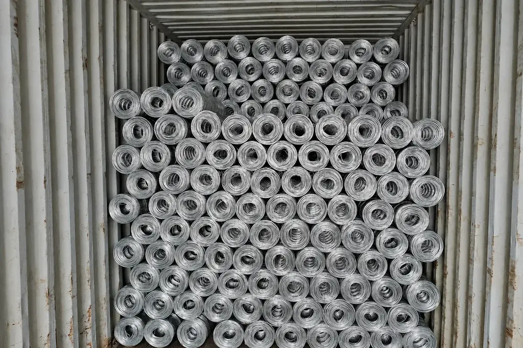 Fence rolls stacked inside a shipping container