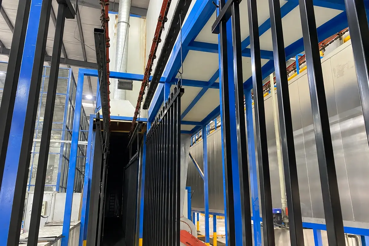 Steel fence sections suspended on a finishing line
