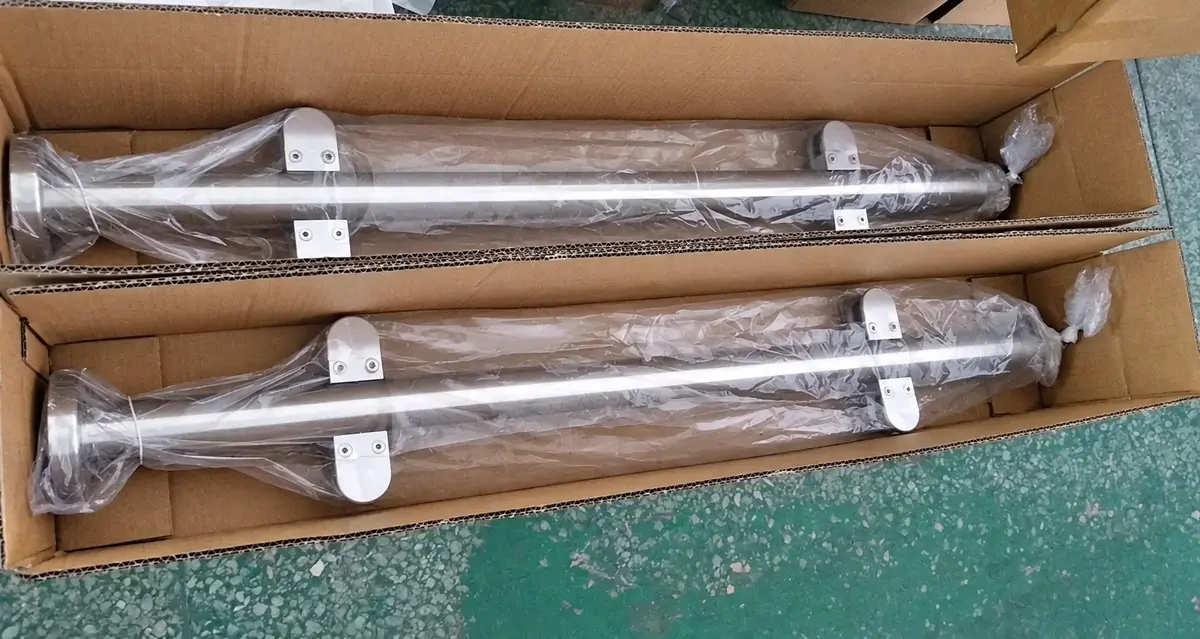 Metal fence posts packed separately in a cardboard box
