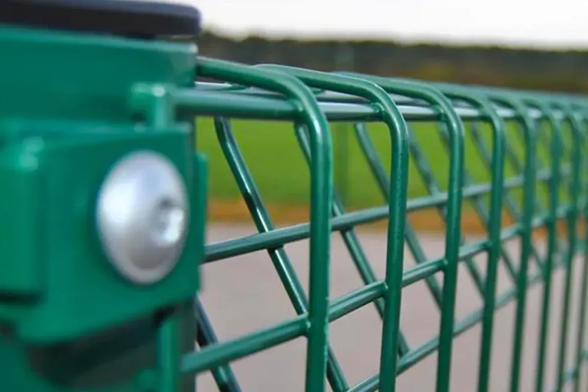 Close view of a green welded mesh panel attached to a post