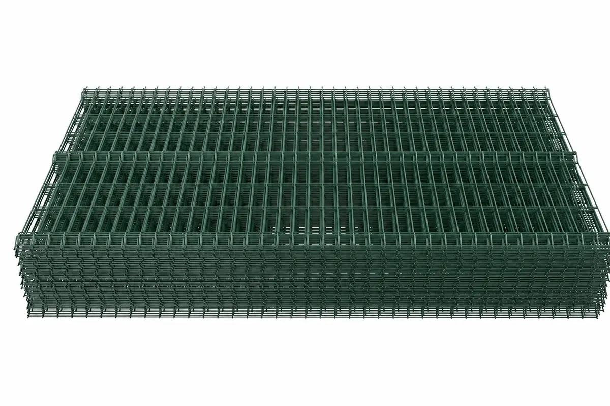 Stack of green welded mesh fence panels
