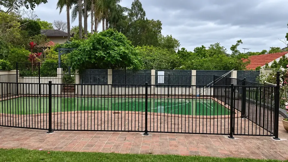 Black metal double gate and matching residential fencing