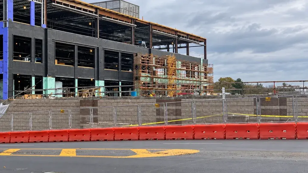 Temporary fencing separating a building site from a road