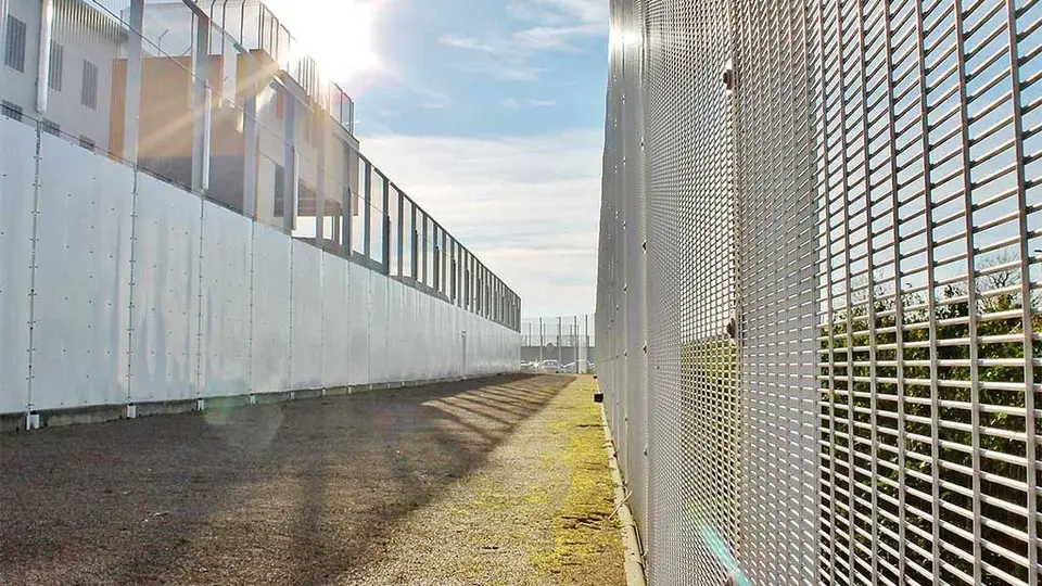 High mesh perimeter fence around a secure site