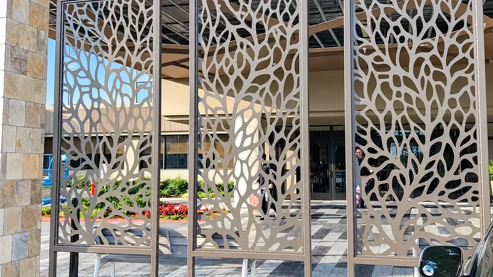 Decorative laser cut metal panels stored in a workshop