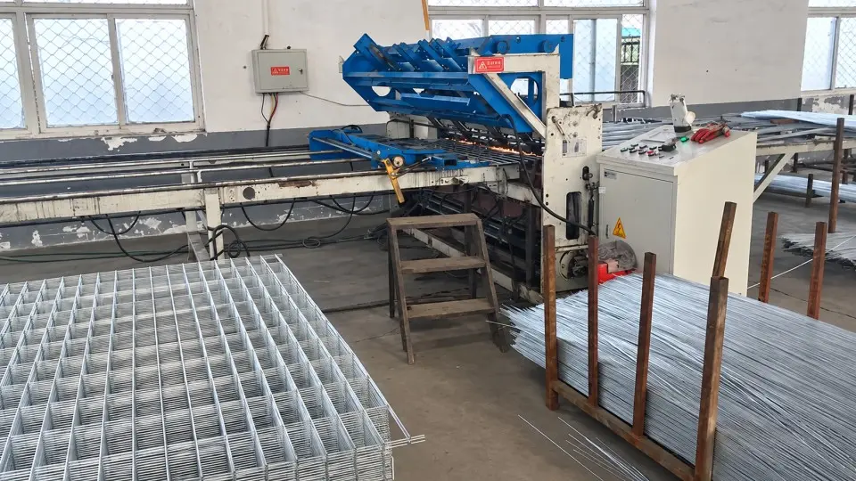 Welded mesh panels leaving a production machine