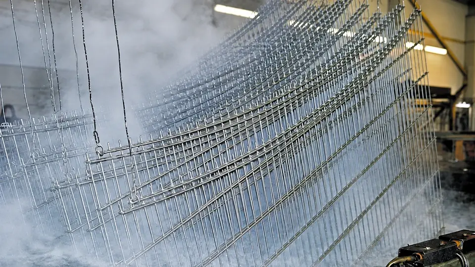 Mesh panels being lifted from a galvanizing bath