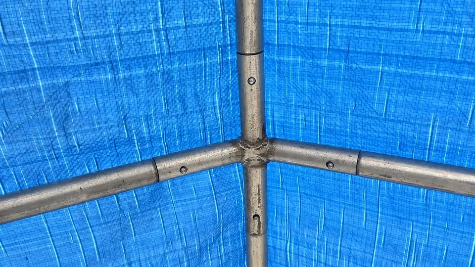 Clamped metal tubes supporting a screened corner