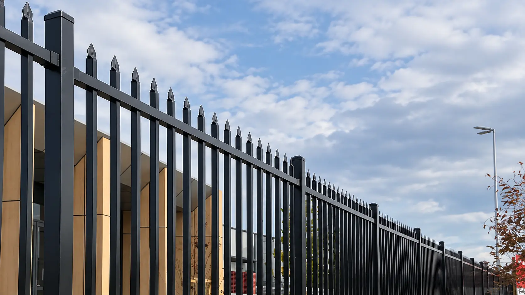 Square metal fence posts and pointed vertical bars