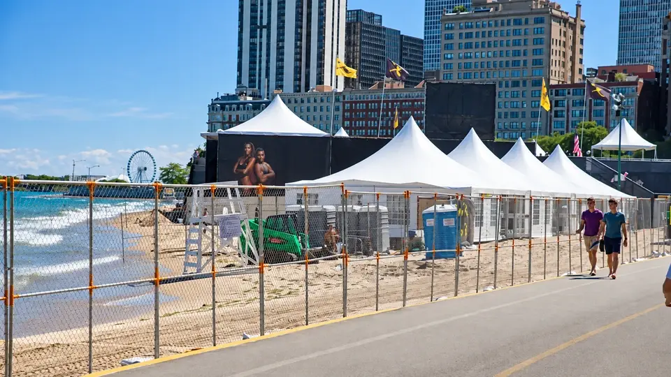 Temporary chain link fence beside waterside event tents