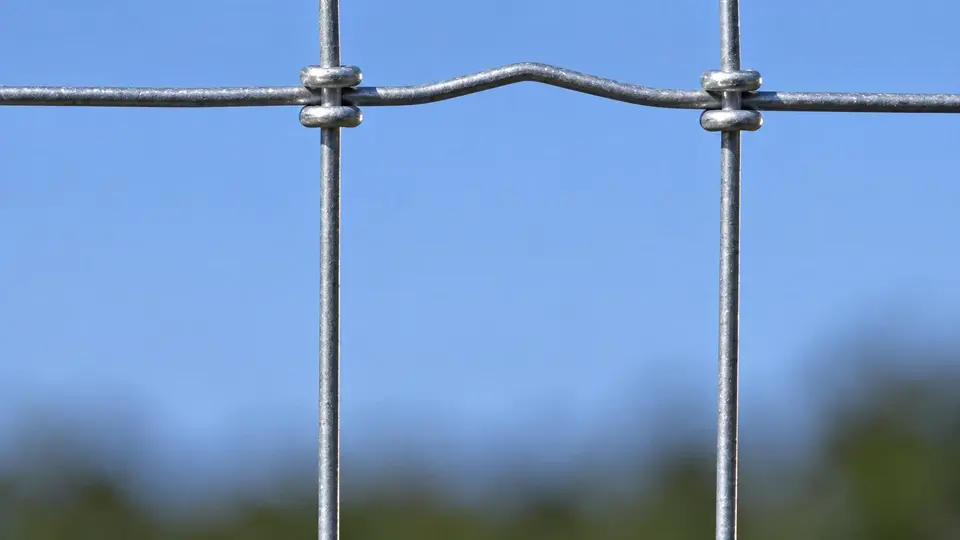 Close detail of knots joining vertical and horizontal horse fence wires