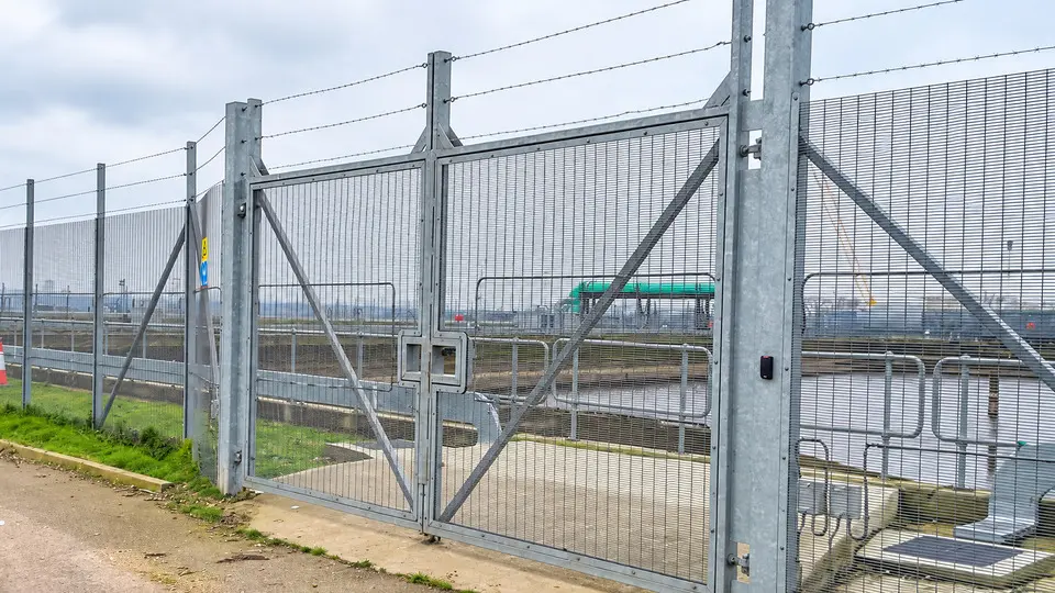 Braced mesh gates connected to a security fence