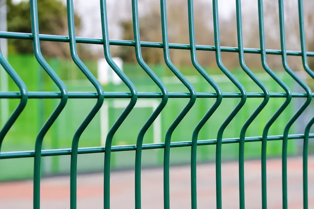 Close view of a V-shaped fold in green welded mesh