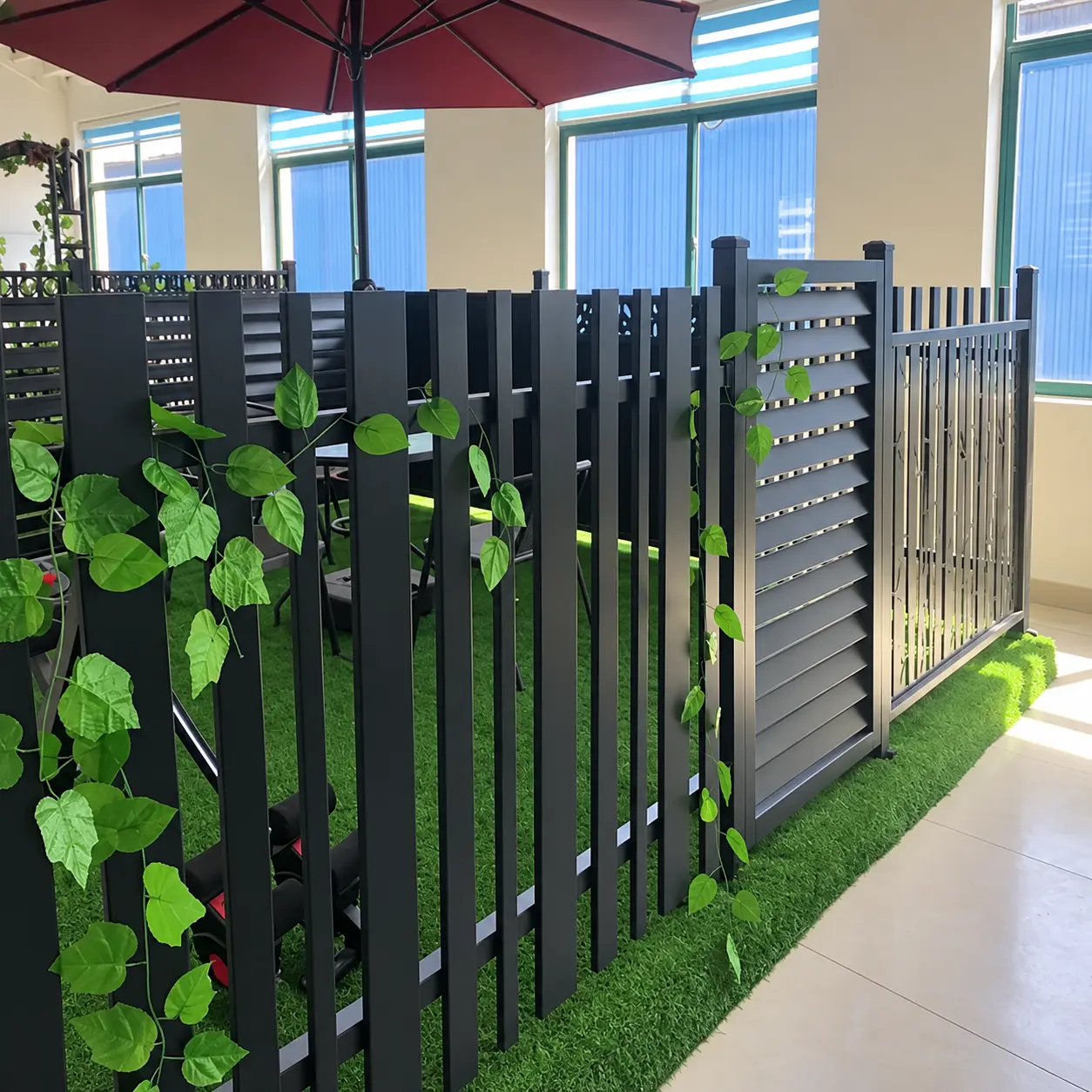 Horizontal and vertical aluminium slat fence samples in a showroom