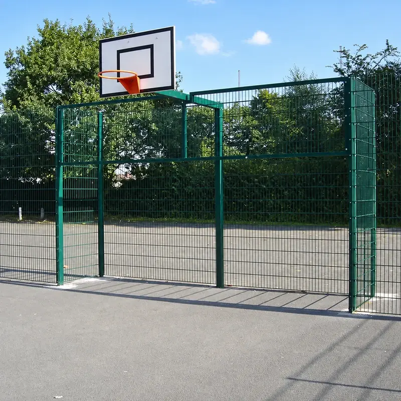 Goal end sports enclosure with posts and a basketball hoop