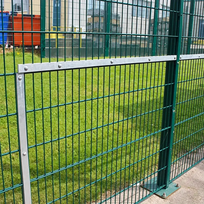 Silver frame fixed to a green sports fence panel