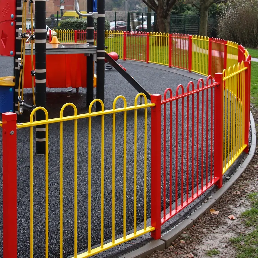 Red and yellow bow top railings around play equipment