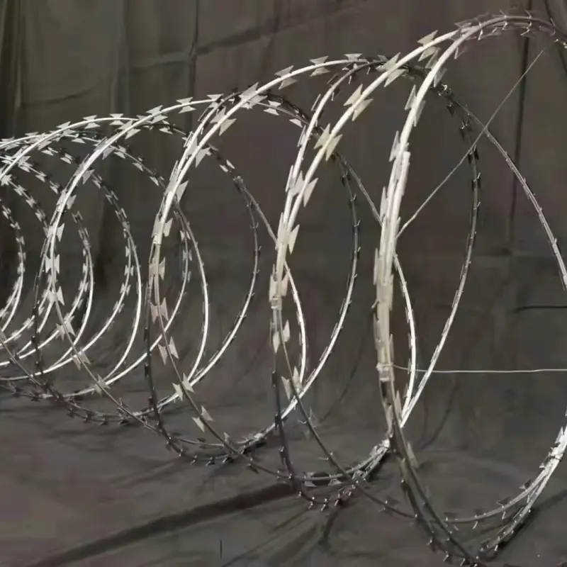 Galvanised razor wire coils extended in linked loops