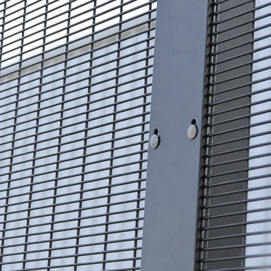 Grey mesh panels secured to a vertical clamp bar with bolts