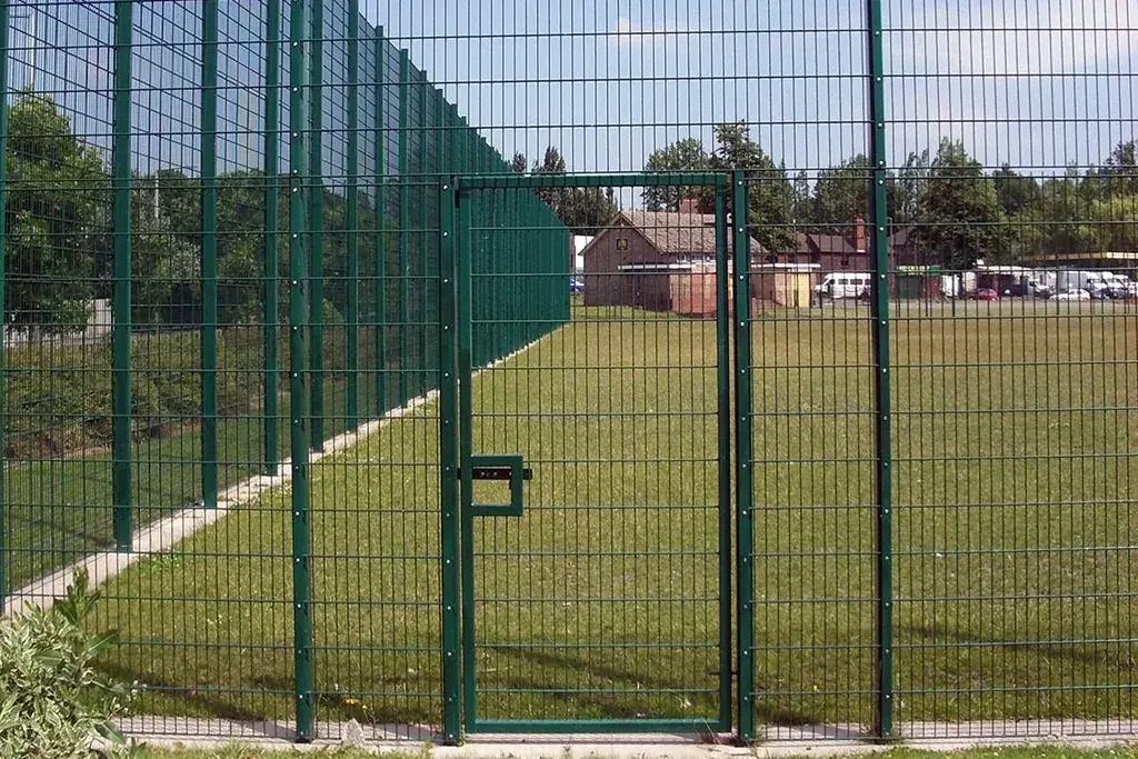 Green twin-wire gate set within a matching fence line