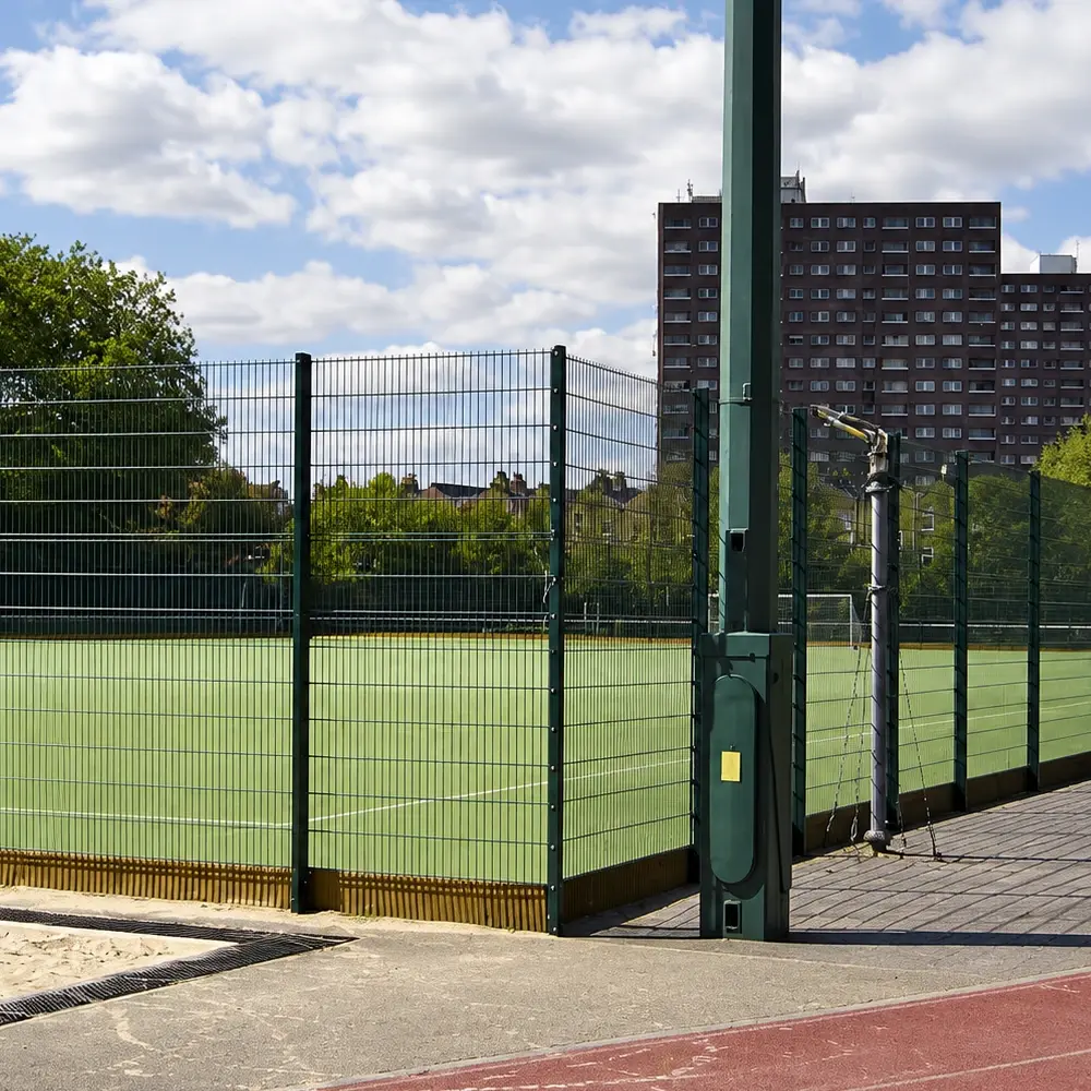 Twin wire sports fence panels and posts at a court corner