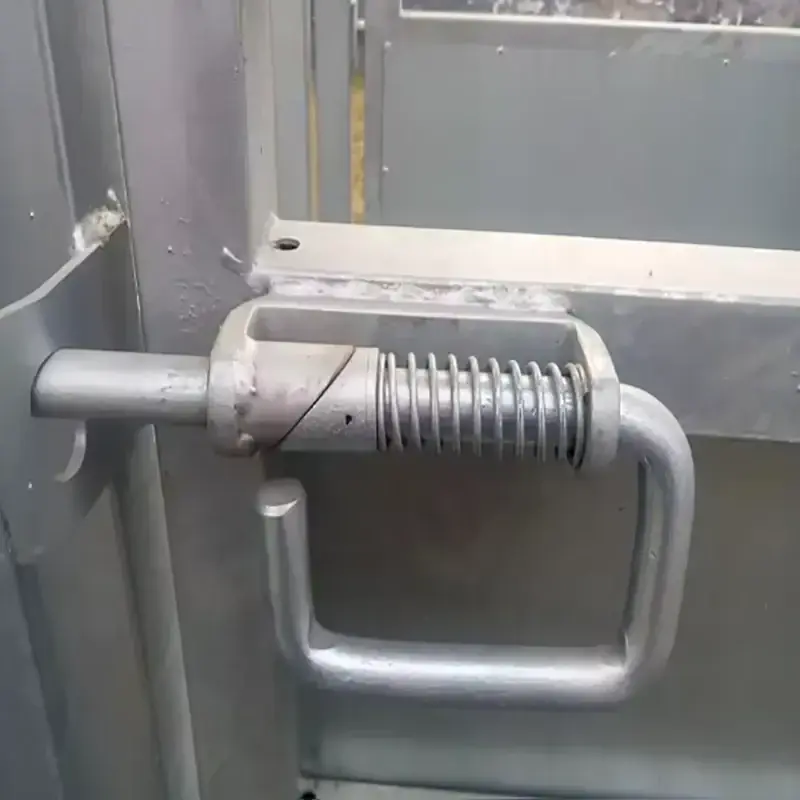 Spring-loaded slam latch installed on a cattle gate frame