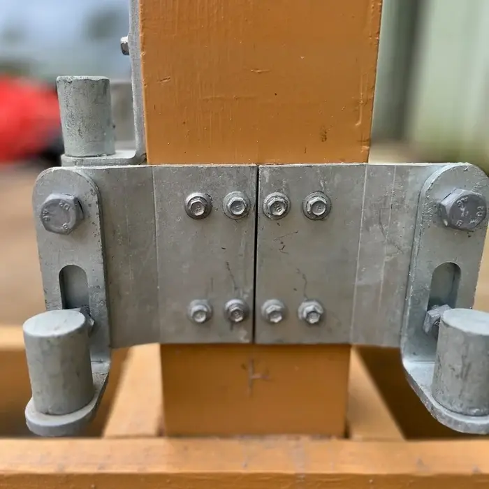 Galvanised bolt-on gate gudgeon mounted to a timber post