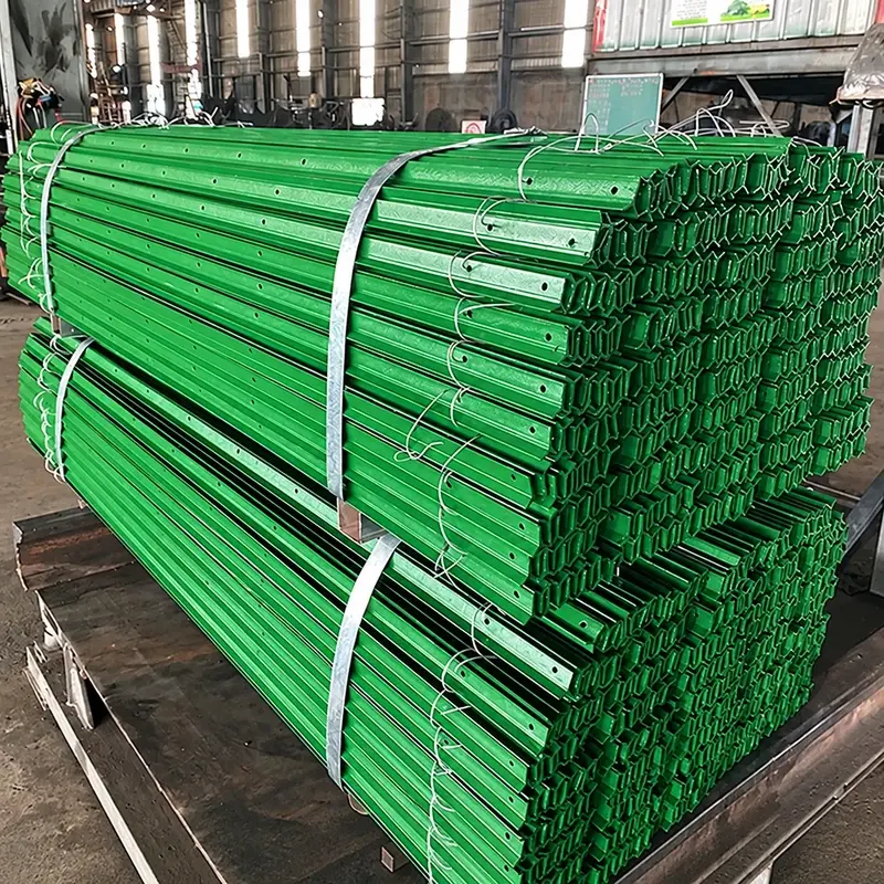Bundled green steel Y-posts showing their three-arm cross-sections