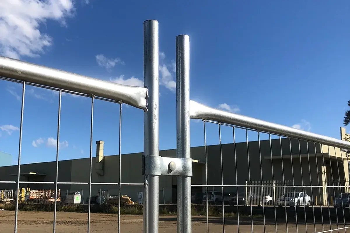 Steel clamp joining adjacent temporary fence frames