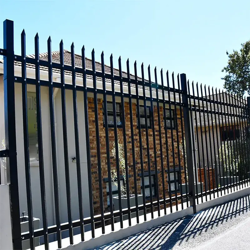 Black steel posts supporting palisade fence panels