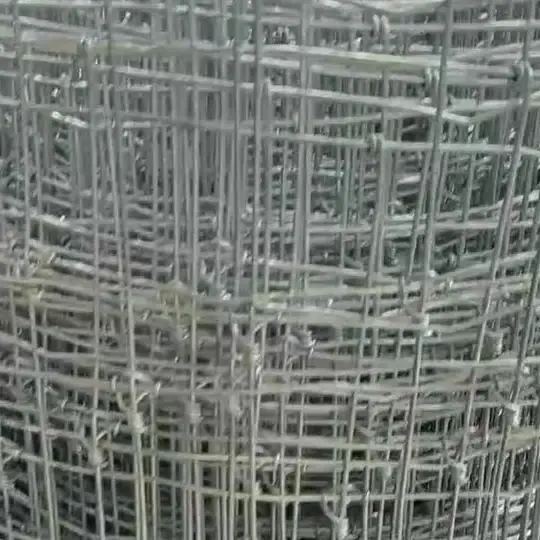 Close-up of fixed-knot wire mesh wound into a roll
