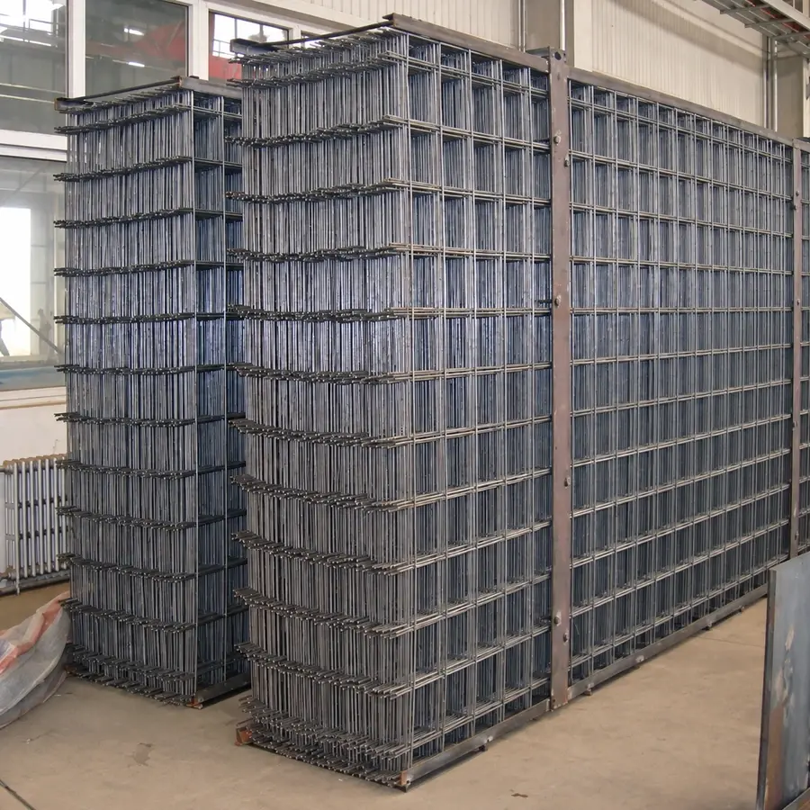 Flat welded mesh panels stacked upright inside a warehouse